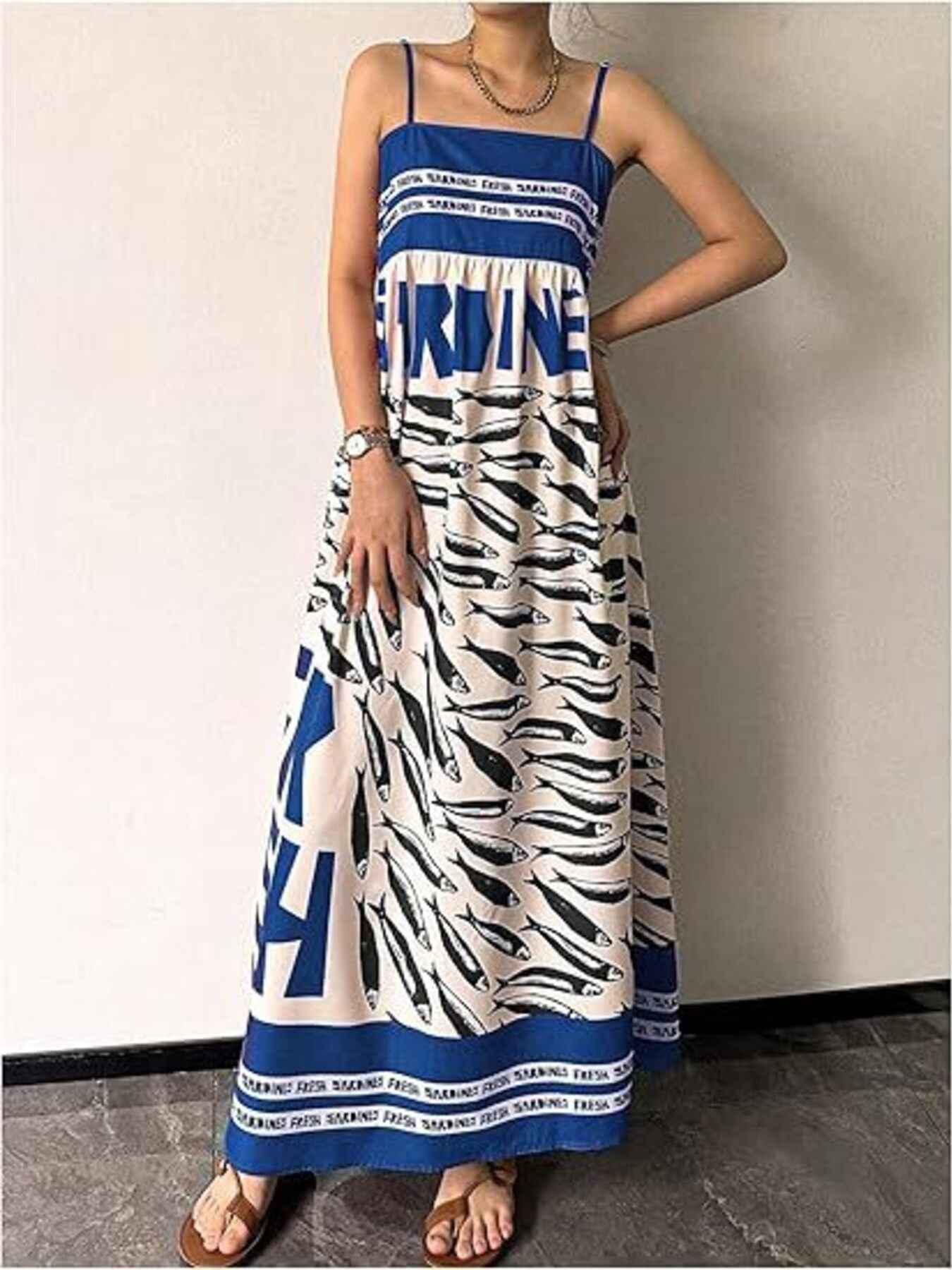 Long dress with blue and white pattern on a plain background