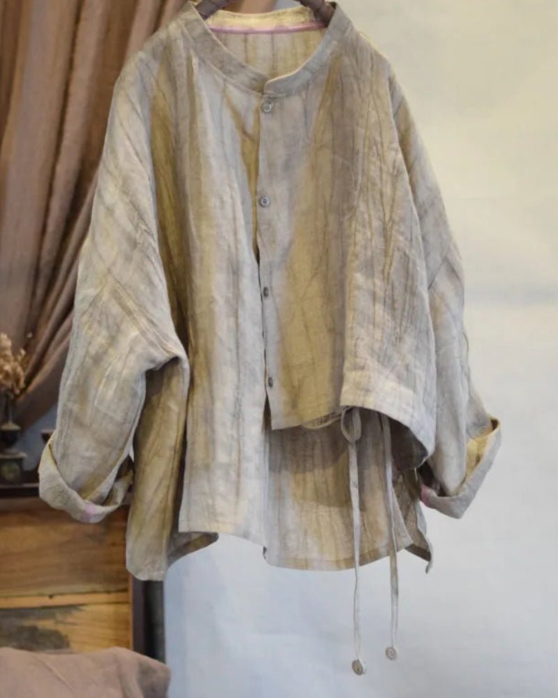 Light brown textured shirt on a mannequin against a neutral background