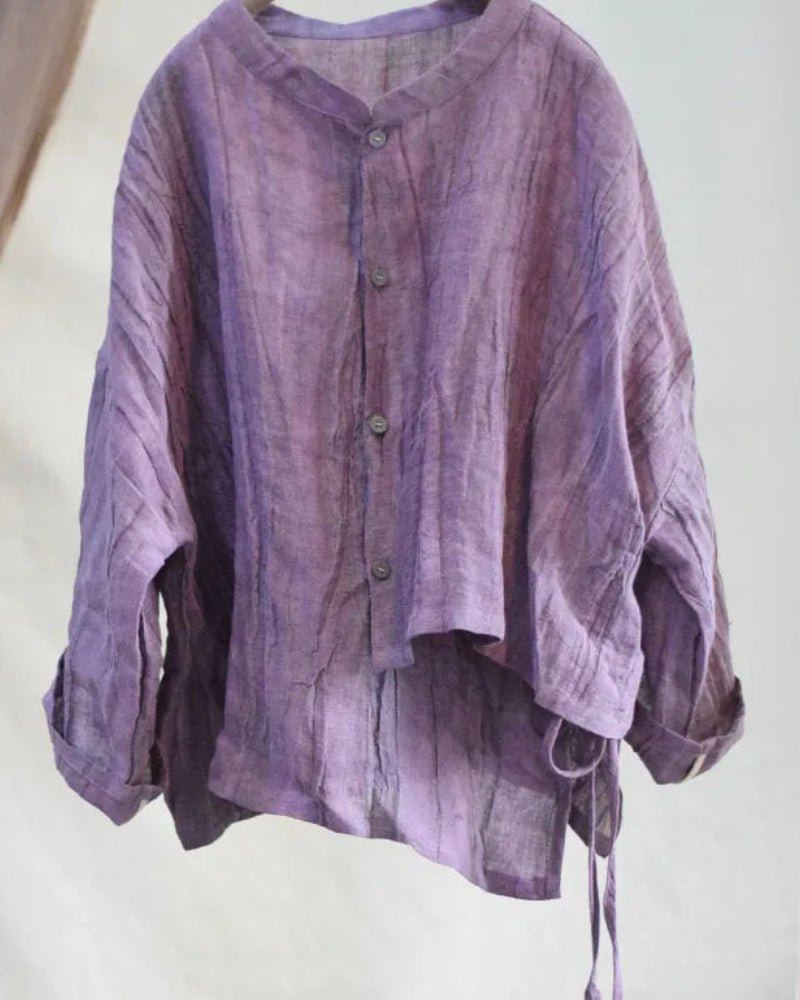 Purple textured shirt on a white background