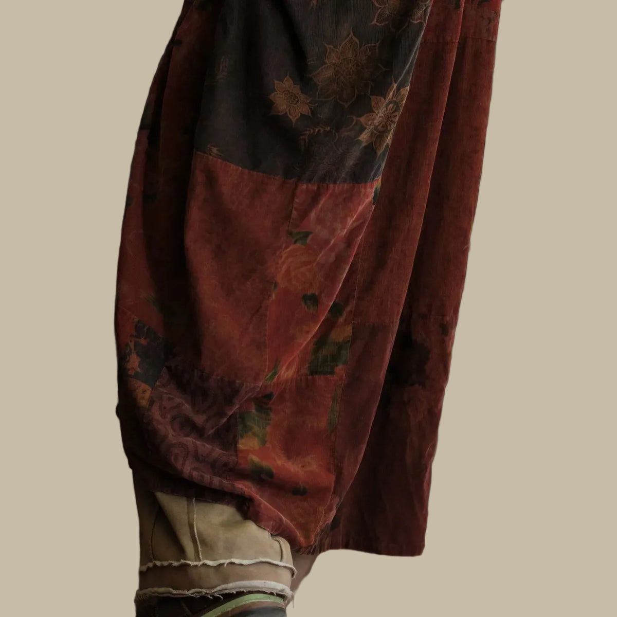 Vintage-style shirt with floral patterns on a wooden surface