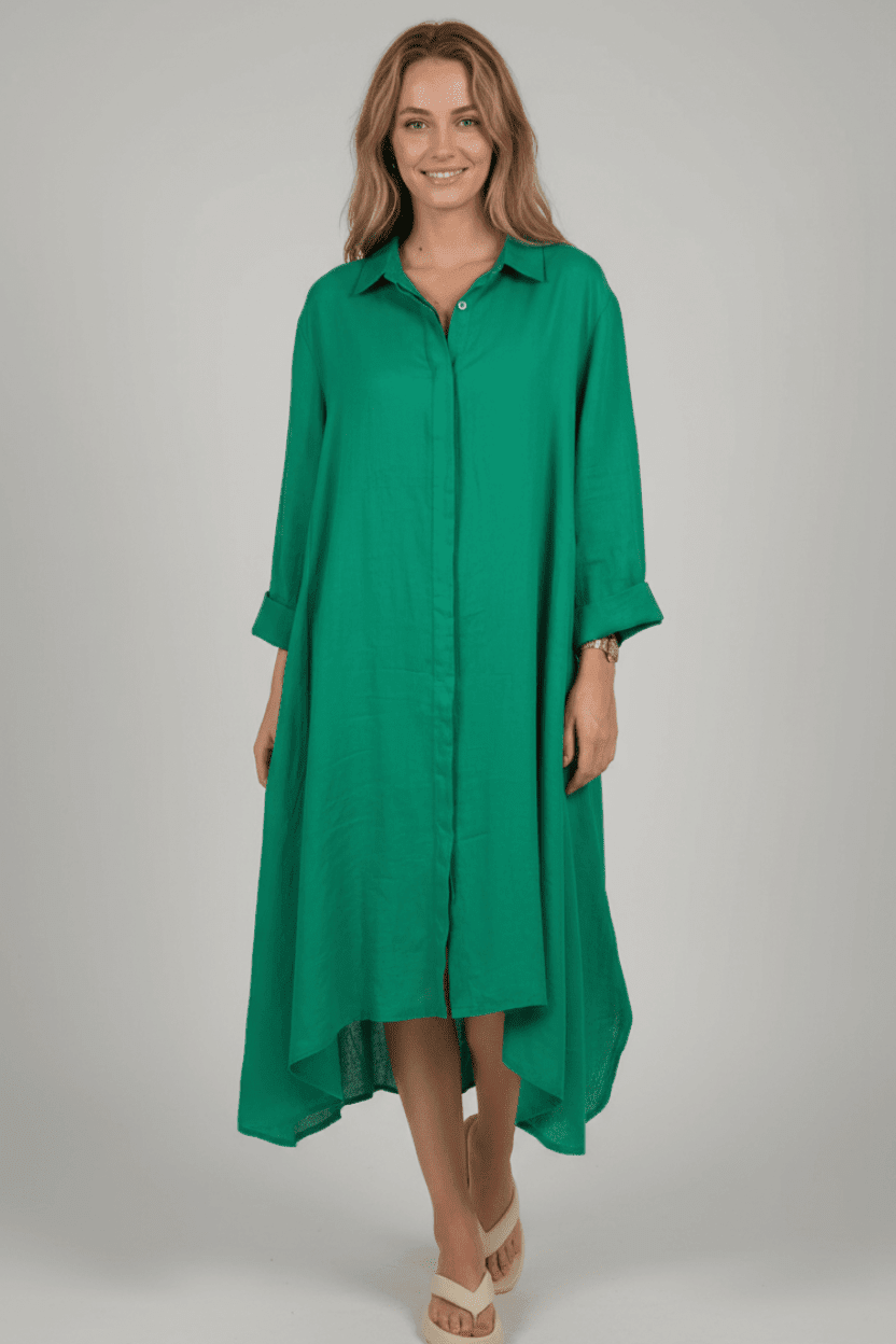 Woman wearing a green dress against a gray background