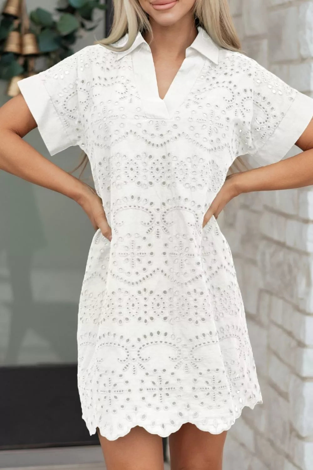 Woman wearing a white lace dress with a blurred background