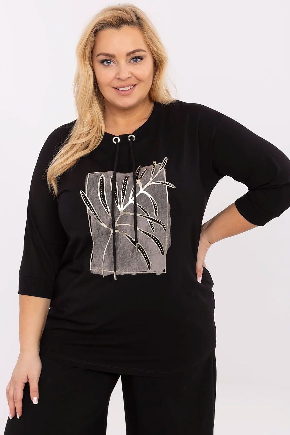 women is wearing black graphic tee shirt, round neck with hoody.