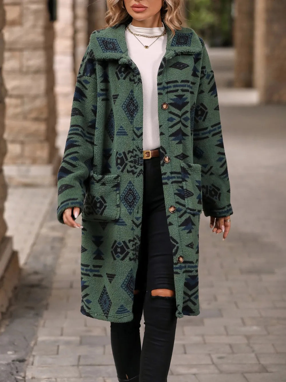 Person wearing a green patterned coat on a stone pavement background