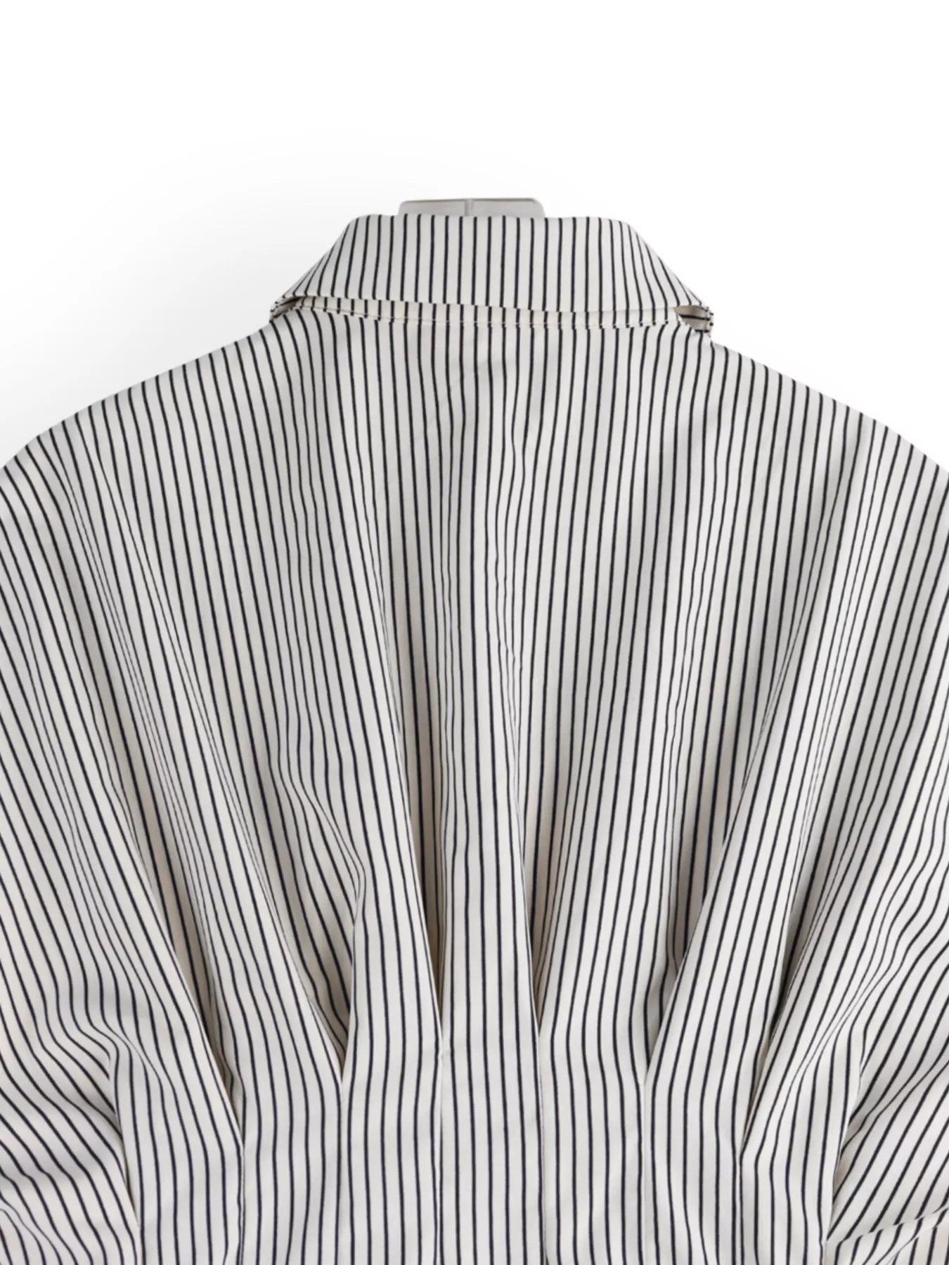 Close-up of a black and white striped shirt on a white background