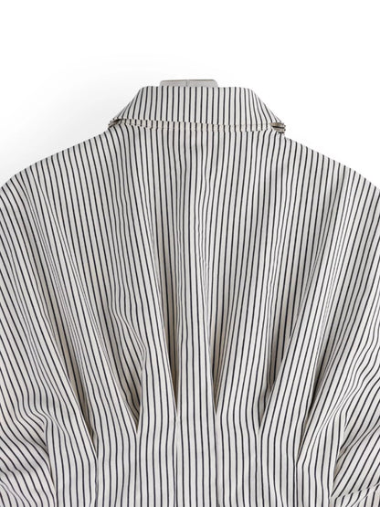 Close-up of a black and white striped shirt on a white background