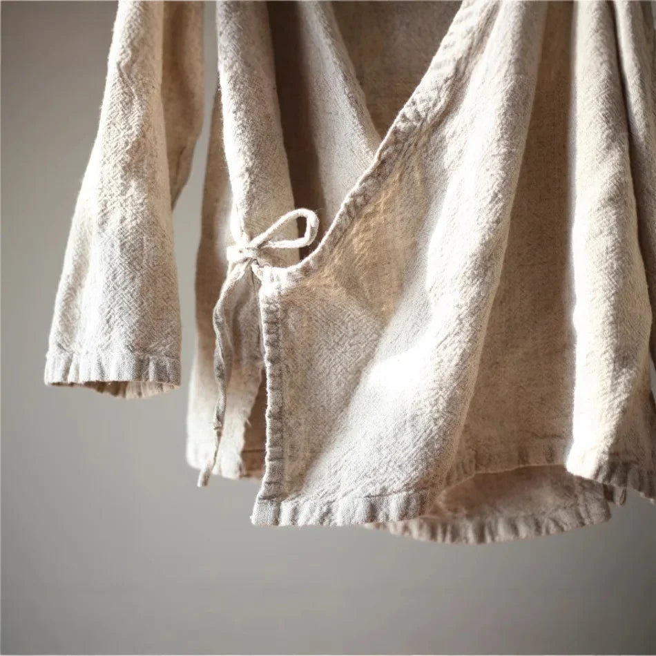 Beige textured garment on a plain background