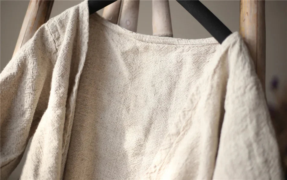 Beige towel draped over a wooden rack