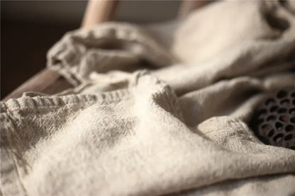 Close-up of a textured fabric with a neutral color palette