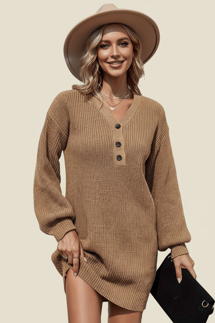 Woman wearing a brown ribbed sweater dress with a beige hat against a beige background