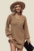 Woman wearing a brown ribbed sweater dress with a beige hat against a beige background