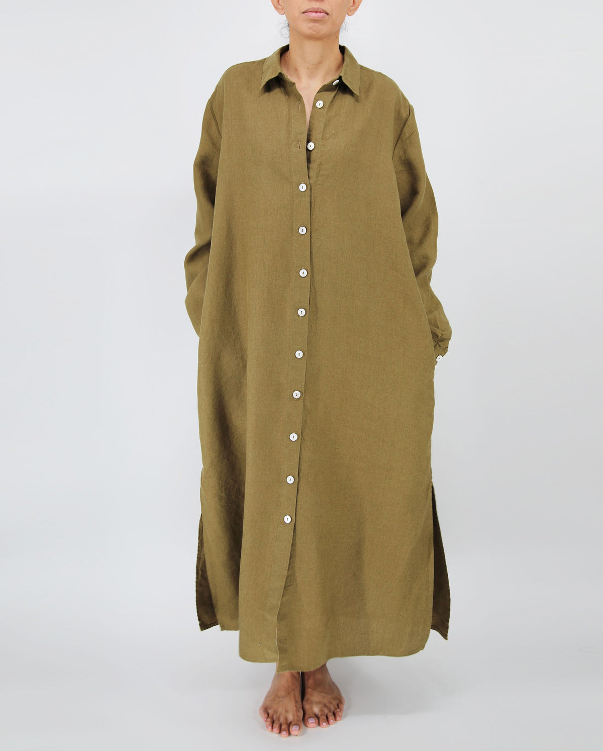 Long olive green dress with buttons on a white background