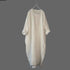 Beige long dress on a hanger against a gray background