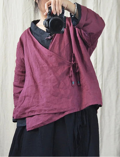 Woman wearing a purple ramie V-neck boho blouse.