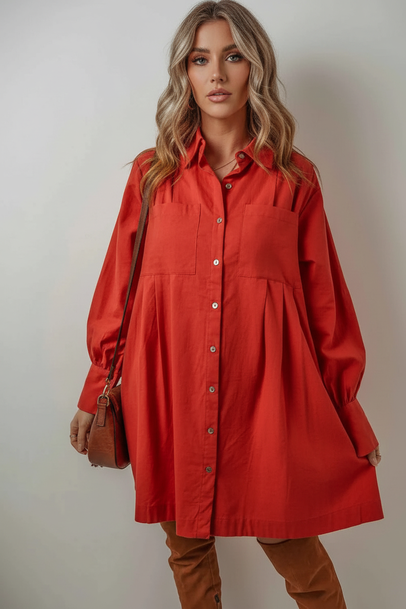 Woman wearing a red dress with a plain background