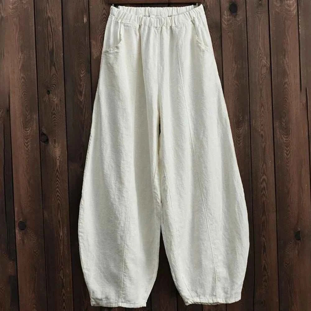 Cream wide-leg bloomers pants with elastic waist, vintage-inspired, relaxed silhouette.