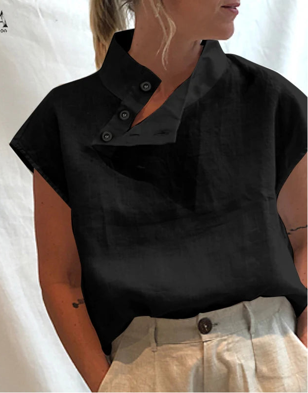 Person wearing a black short-sleeve shirt with a collar against a white background, branded &