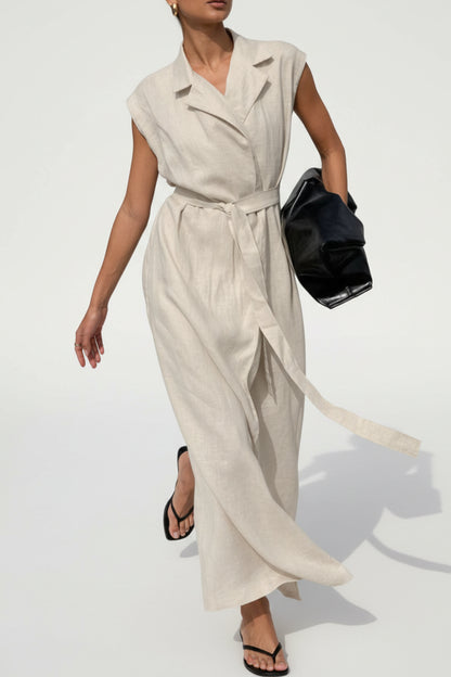 Person wearing a white dress crossing a street with cars and buildings in the background