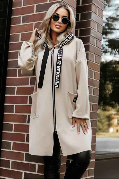 The Arden Cozy Hooded Coat is designed for effortless layering and everyday comfort