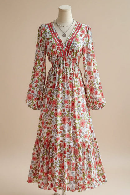 Floral dress on a mannequin against a plain background