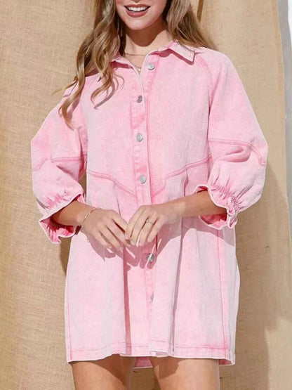 Person wearing a pink denim dress against a beige background