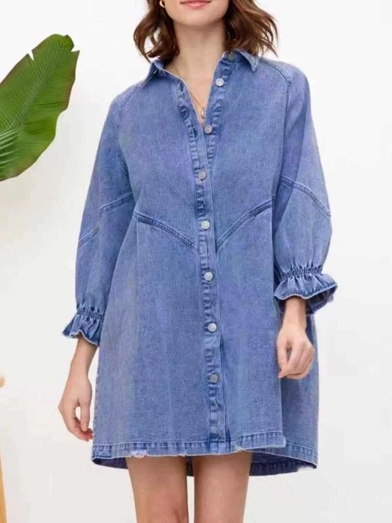 Woman wearing a blue denim dress with a white background