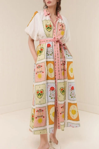 Woman wearing a colorful patchwork dress with a white background