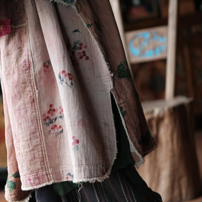 Textile with floral patterns on a wooden background
