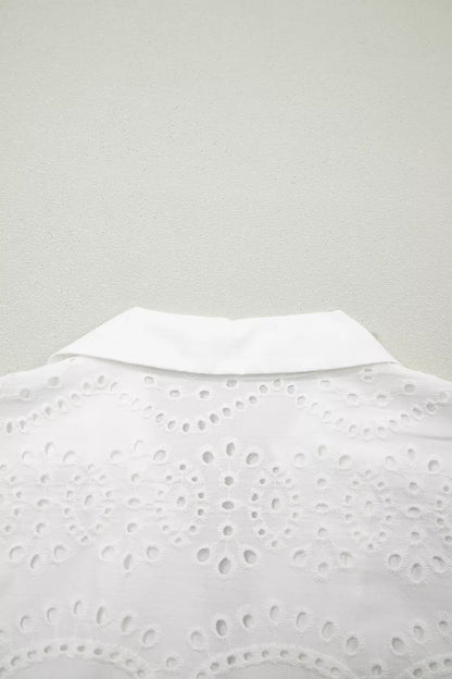 White lace top on a light gray background