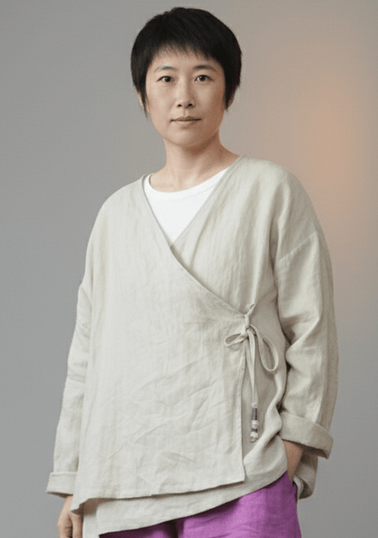 Woman wearing beige ramie v-neck boho blouse